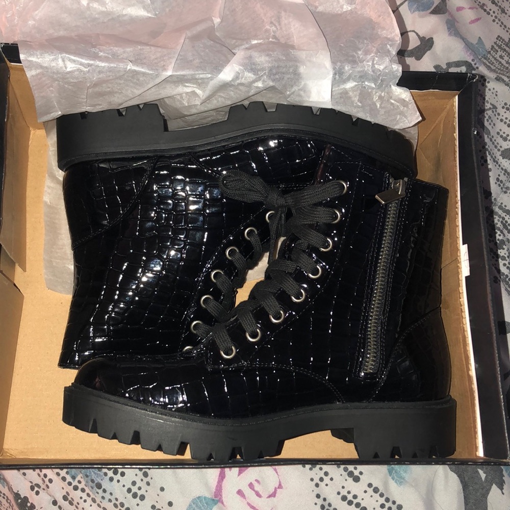 Brand new, never worn black combat boots. Size 5.5